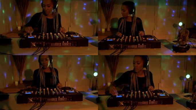 手持一名非裔美国女性DJ在地下俱乐部混合音乐