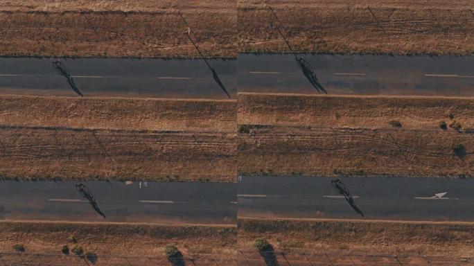 骑自行车的人在乡村道路上骑自行车