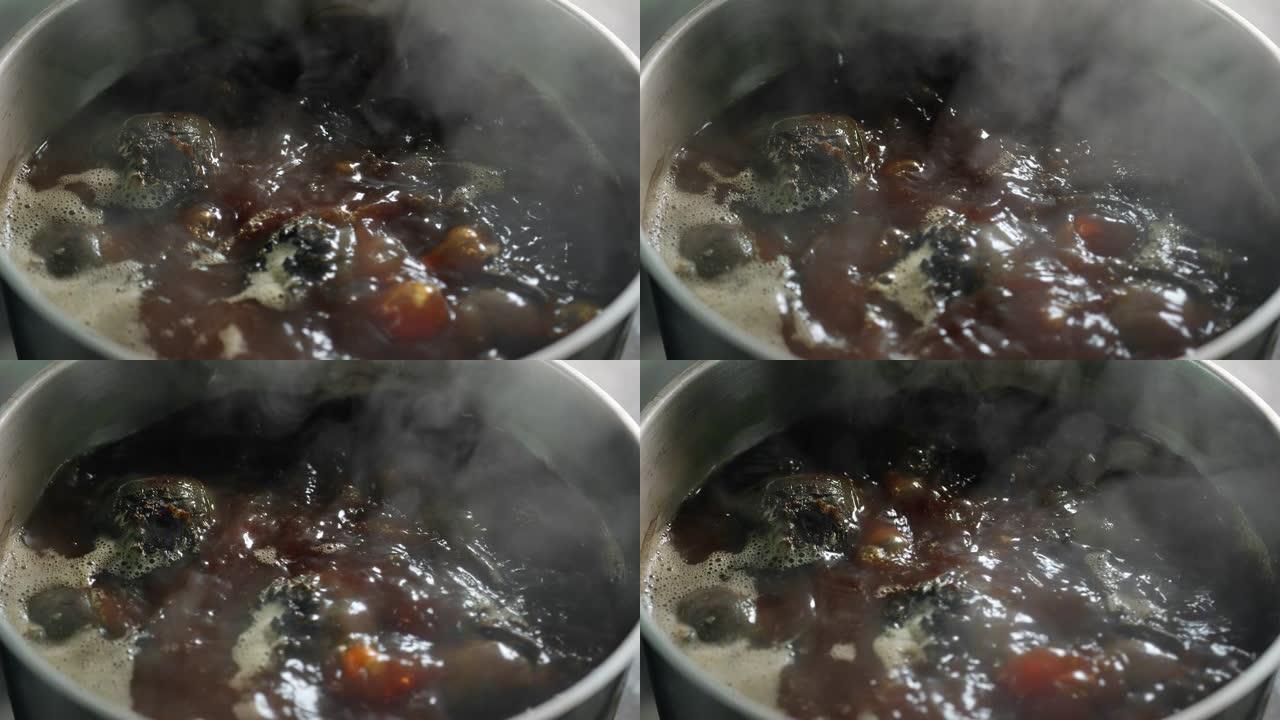 顶视图新鲜甜菜在沸水锅中烹饪慢动作。在4k红色相机上近距离拍摄