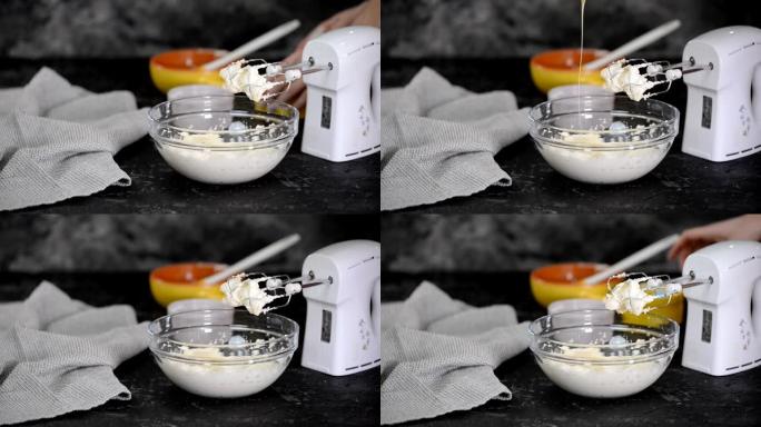 用搅拌器混合奶油。将液态白巧克力倒入带有奶油的碗中。