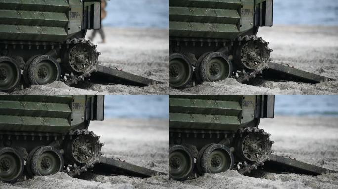 军事演习中，两栖陆军坦克在沙滩上的毛毛虫