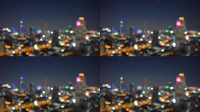 泰国曼谷市摩天大楼的Bokeh背景灯光，夜间照片模糊。城市景观