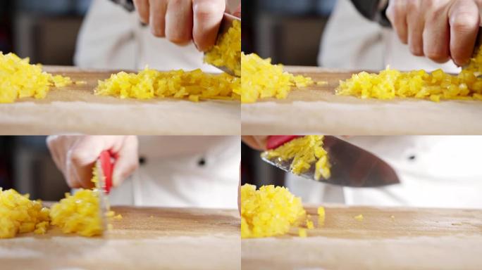 厨师刀切成黄色甜椒的慢动作特写