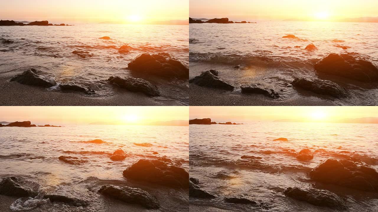 海上日落/日出礁石拍打岸边