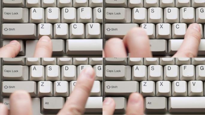 男性手指按下白色键盘上的CTRL + V按钮。慢动作和宏观视图