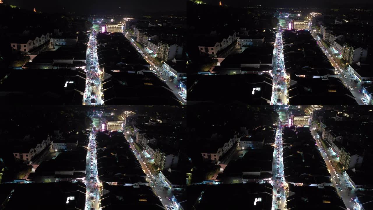 杭州市著名行人拥挤街道区域夜间照明航空全景4k中国