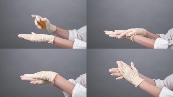 戴着一次性手套的女医生正在上面喷洒防腐剂。医学妇女消毒橡胶手套。新型冠状病毒肺炎。