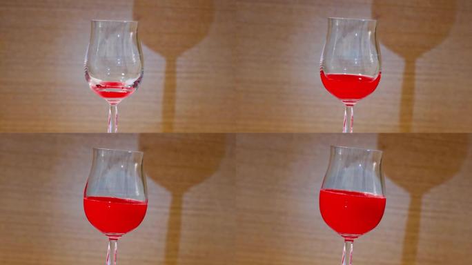 红色液体填充玻璃高脚杯