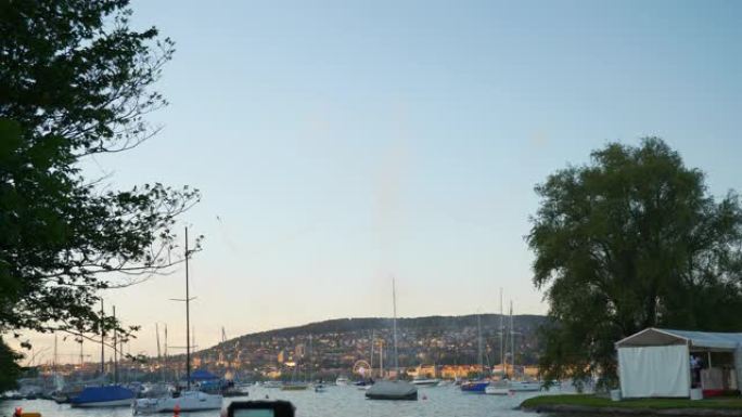 夏季日落时间苏黎世市著名湖滨湾直升机假日秀全景4k瑞士