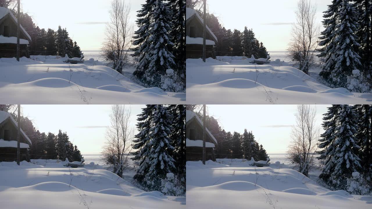 冬季景观。冰冻的叶尼塞河景色。位于西伯利亚的俄罗斯村庄被雪覆盖的木屋。俄罗斯。4K