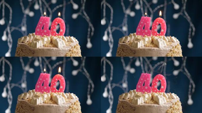 Birthday cake with 40 number pink candle on blue b