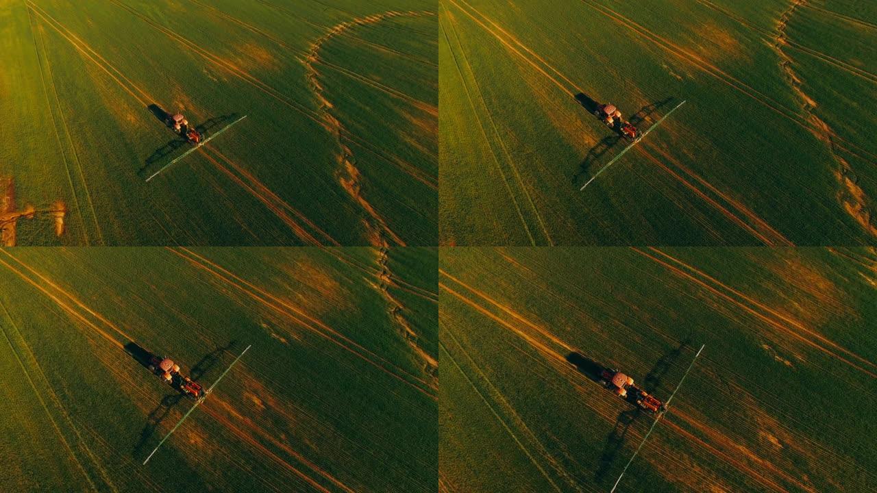 用拖拉机在野外鸟瞰图上喷洒农药和肥料