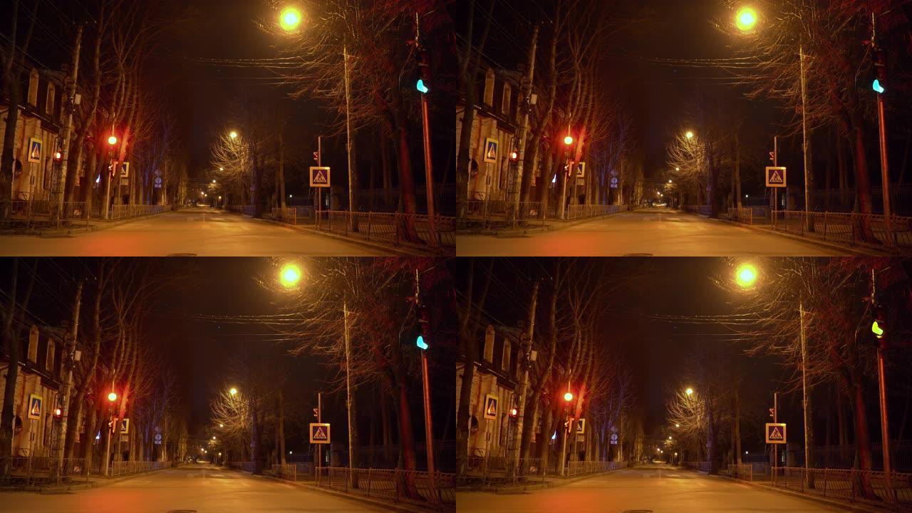 辛菲罗波尔夜间空荡荡的城市街道。行人过路交通灯。