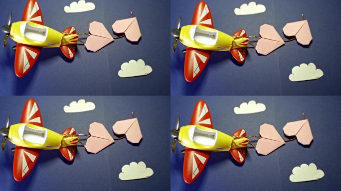 折纸纸粉色心形飞机玩具。