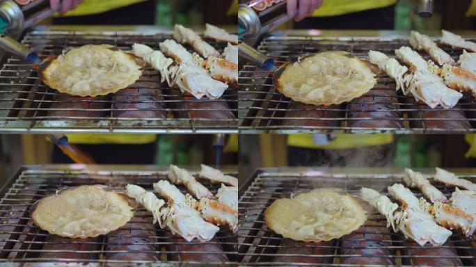 在炉子上烤的扇贝和龙虾
