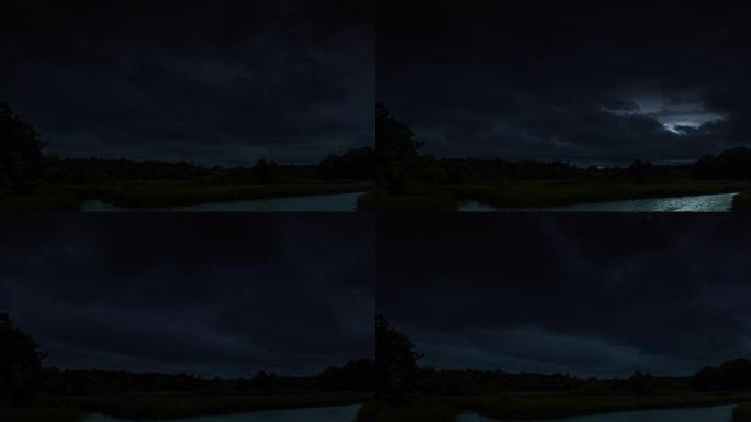 雷雨云在晚上，有闪电。4k延时循环。夜暴云景观。令人印象深刻的闪电风暴天空。几个强大的闪光灯和灯光。