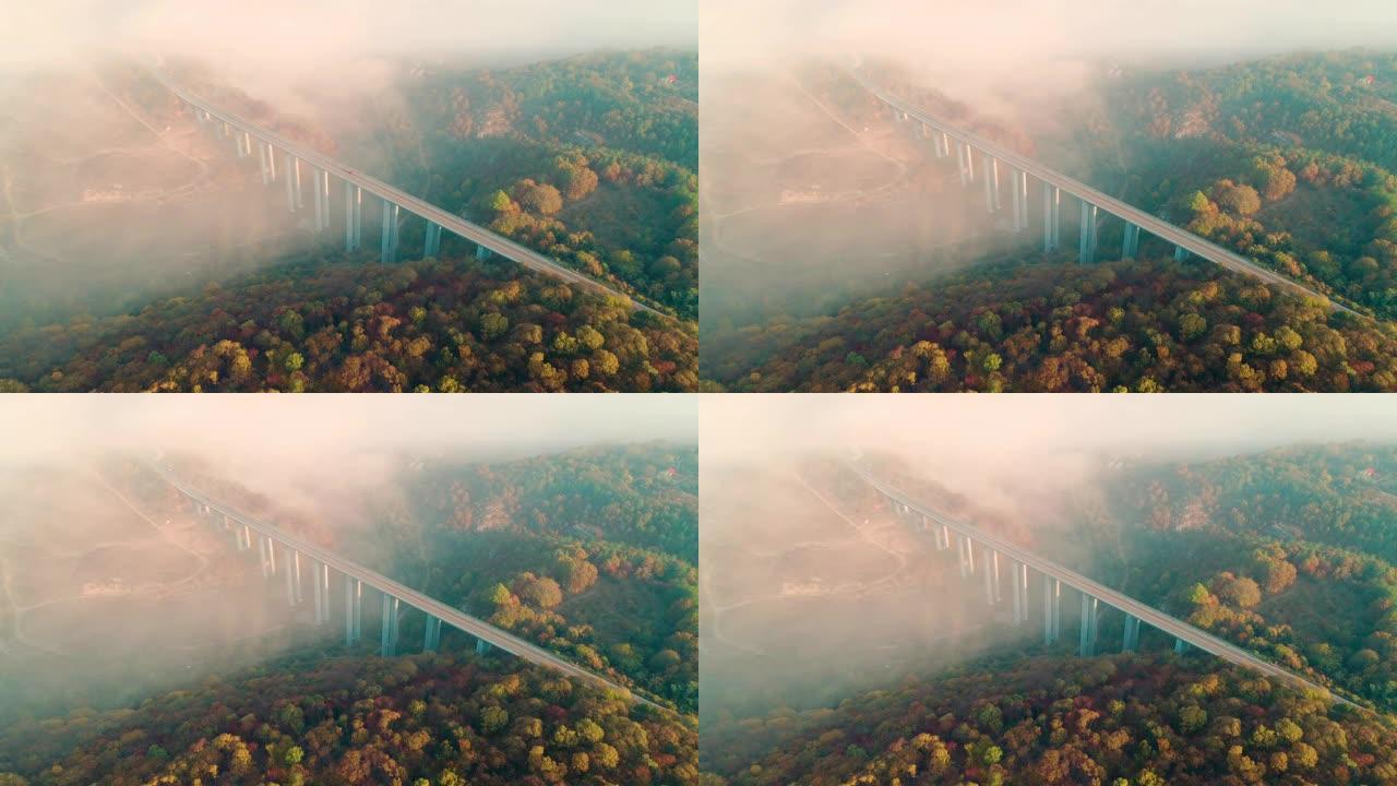 高架桥上高速公路的鸟瞰图，高科技工程建设，赭色景观和天空中的低云。
