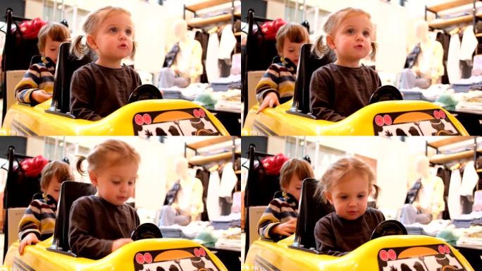 小女孩驾驶玩具车