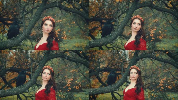 肖像漂亮的黑发女人，手里拿着巨大的黑色乌鸦。女王的形象，红色连衣裙，优雅的发型，金色皇冠和红宝石耳环