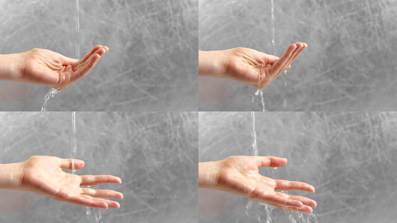 水从女人的手中倾泻而出。女人正试图把水放在手掌里。时间概念。