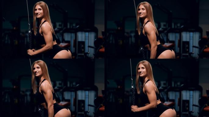 健身妇女在健身房锻炼肌肉