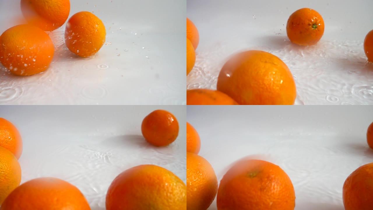 多汁的橘子和飞溅。慢动作。