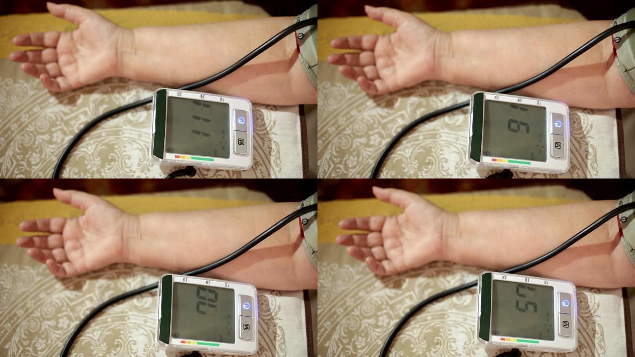 测量血压的成年女性。成年后的医疗保健。