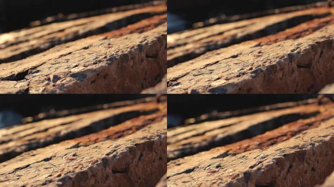 海滩上的石头混凝土板的抽象多莉镜头