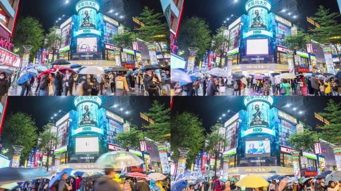 西门町夜市的时间流逝。台湾台北，晚上在商店街上散步的人们