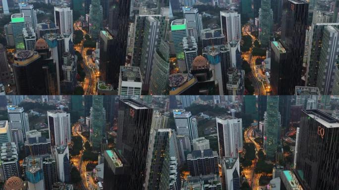 暮光之城照明吉隆坡市区在交通街上飞行空中全景4k马来西亚