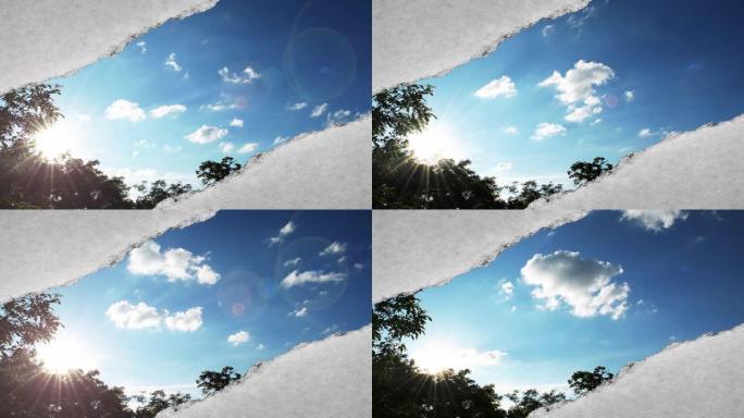 创意时间圈视频，在日落时分，在蓝天中快速移动的云彩，这些云彩可以通过旧复古垃圾老式纸的边缘撕裂的孔看