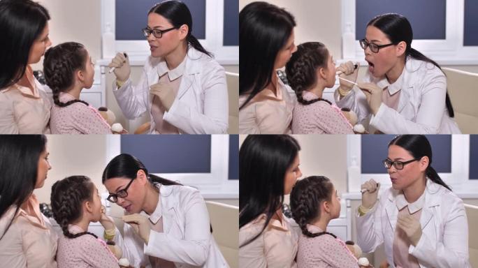 儿科医生检查儿童患者的喉咙