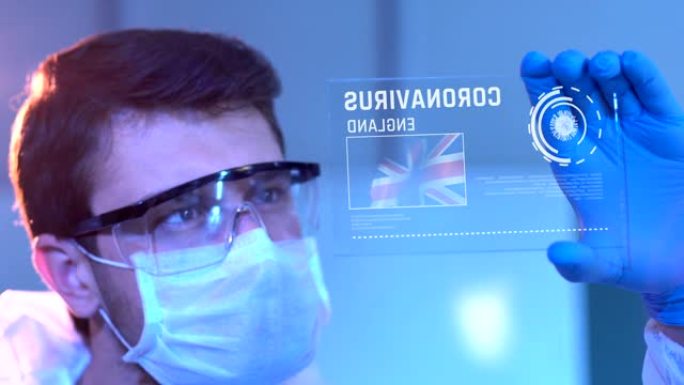 研究人员在实验室的数字屏幕上查看英国的冠状病毒结果