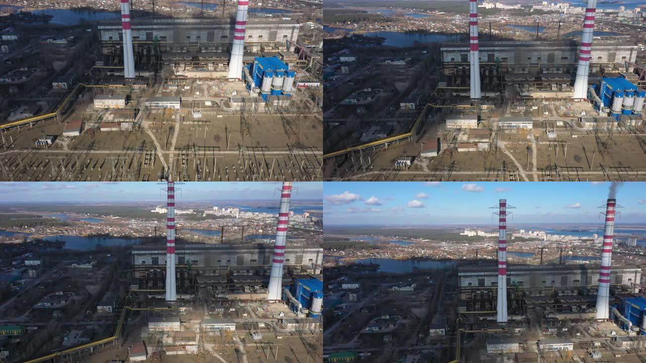 燃煤电厂灰烟高的烟囱管道的鸟瞰图。用化石燃料生产电力。