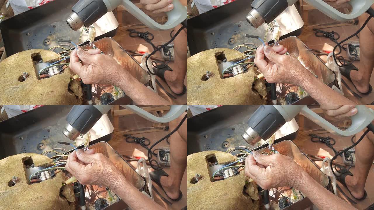 技术员在破碎的蒸汽熨斗上工作的镜头