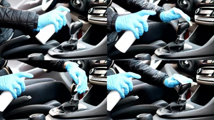 戴手套的人清洁汽车首先照顾手动变速箱