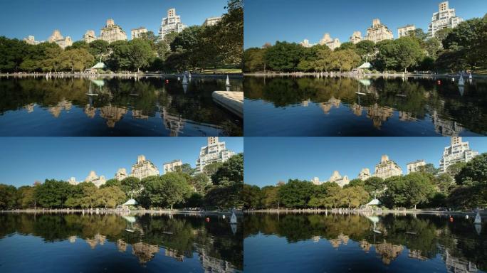 豪华高端公寓和公寓住宅在美国纽约市中央公园的温室水和曼哈顿天际线上空升起