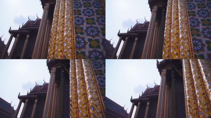 仰望泰国寺庙建筑。泰国曼谷翡翠佛寺Phra Kaew。平移镜头