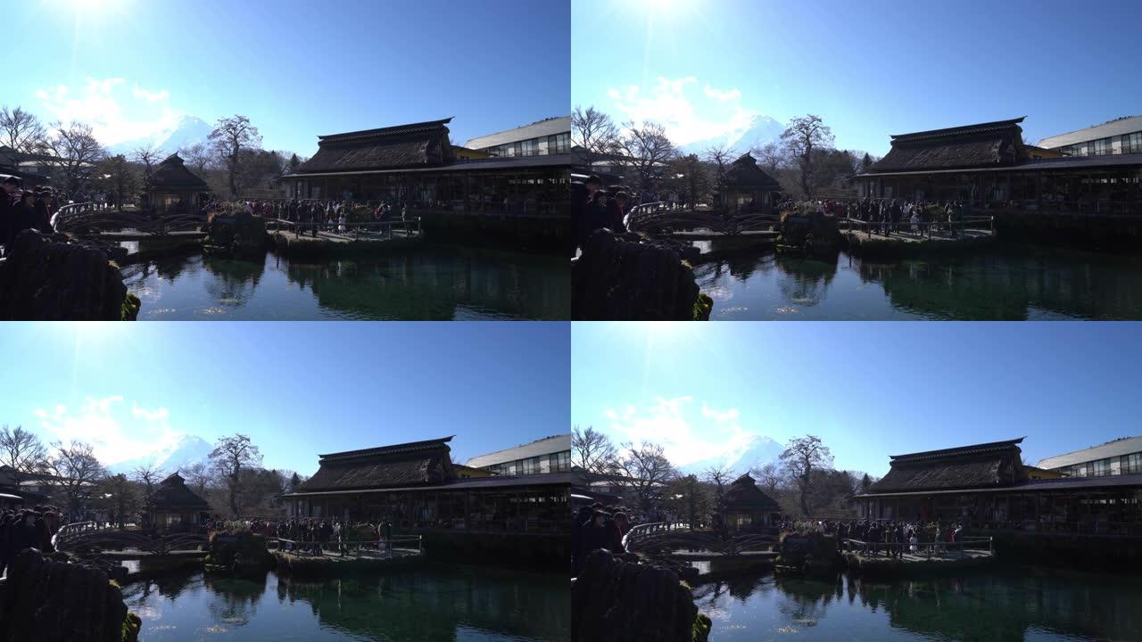 背景是富士山的日本。Oshino Hakkai是一个风景秀丽的小村庄，有8个池塘。