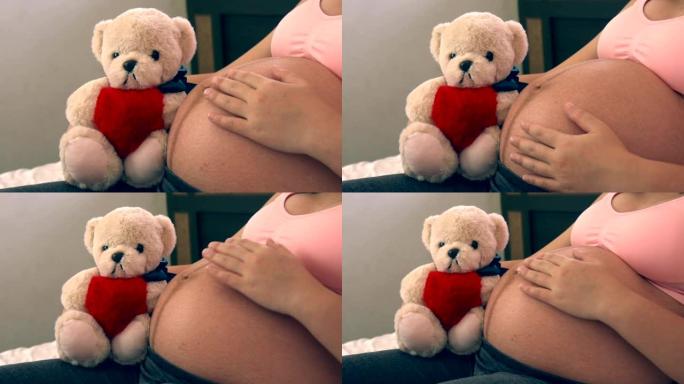 快乐的孕妇和家里的孩子。