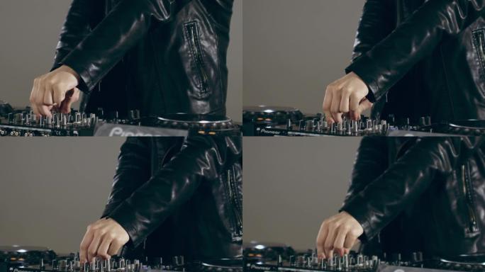 DJ在混音台上使用控件