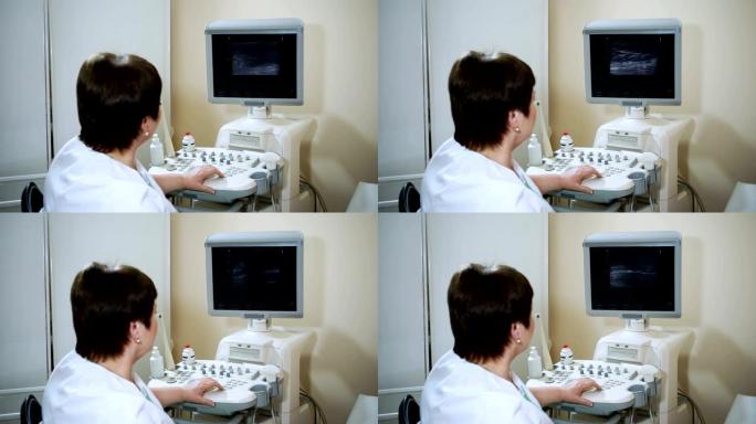 女医生使用超声波扫描仪检查妇女的腹部器官。高清