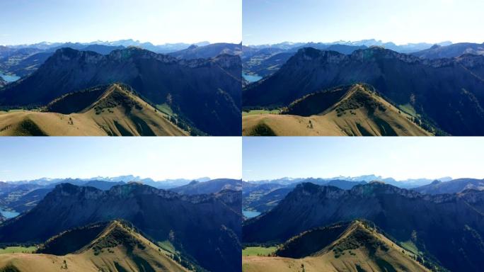 瑞士山顶的航拍。Serpantine道路和雪顶