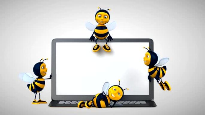 笔记本电脑旁边的有趣蜜蜂