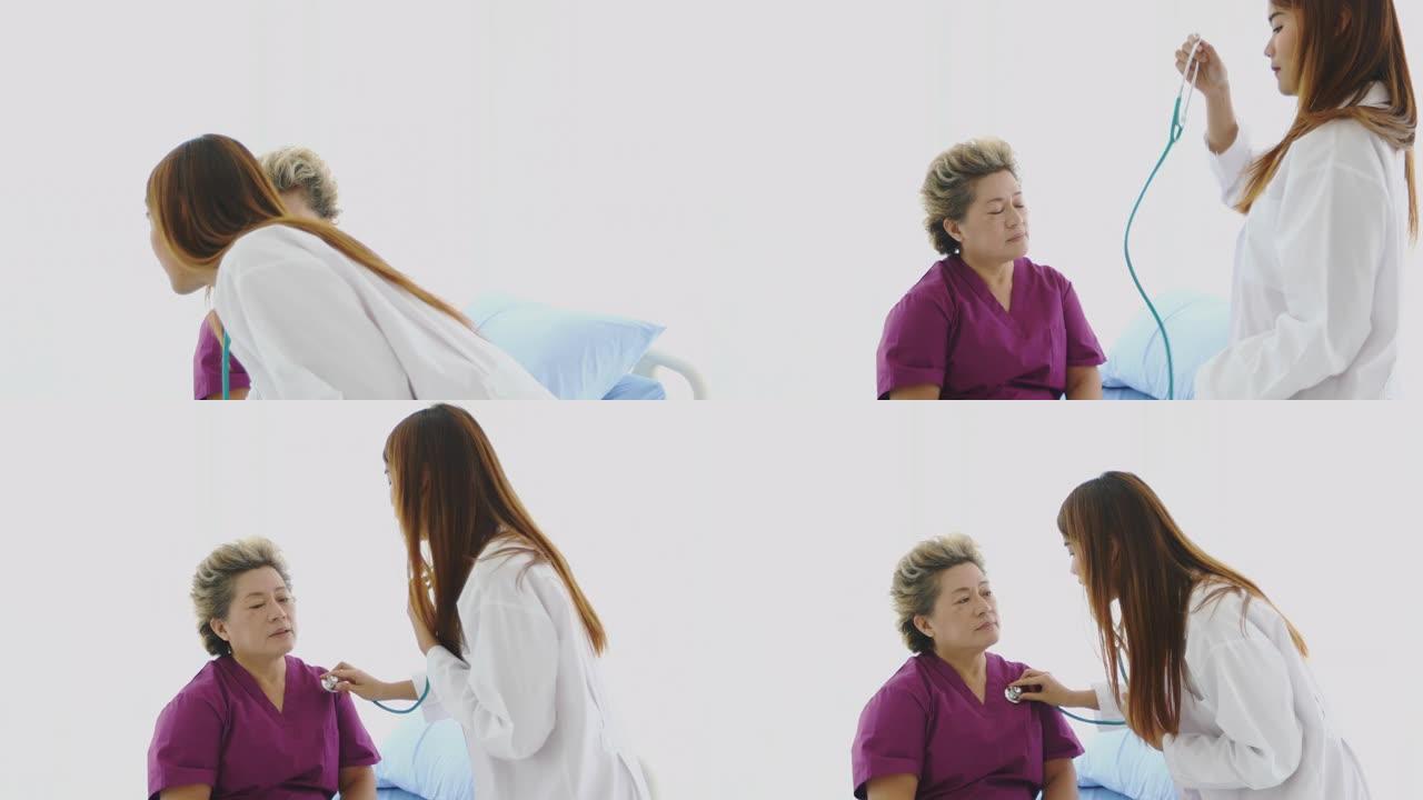 医生在医院使用听诊器检查老年妇女患者