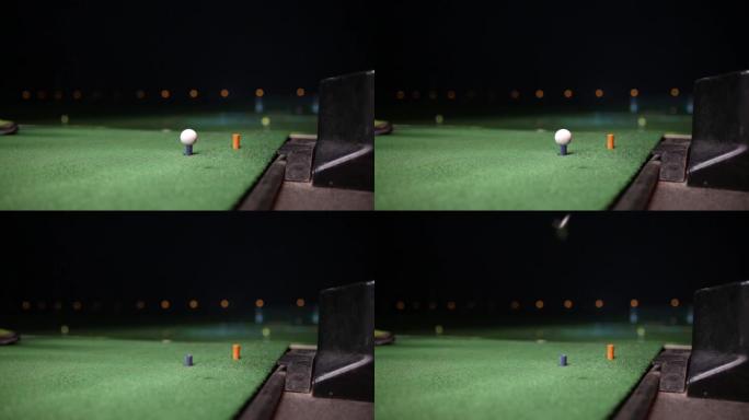 高尔夫球手夜间击打高尔夫球的视频