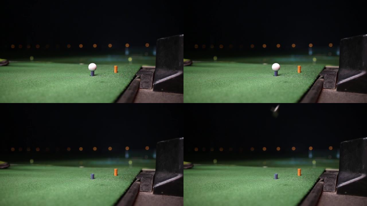 高尔夫球手夜间击打高尔夫球的视频