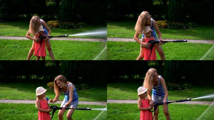 年轻女子和小女孩用高压水设备洗汽车