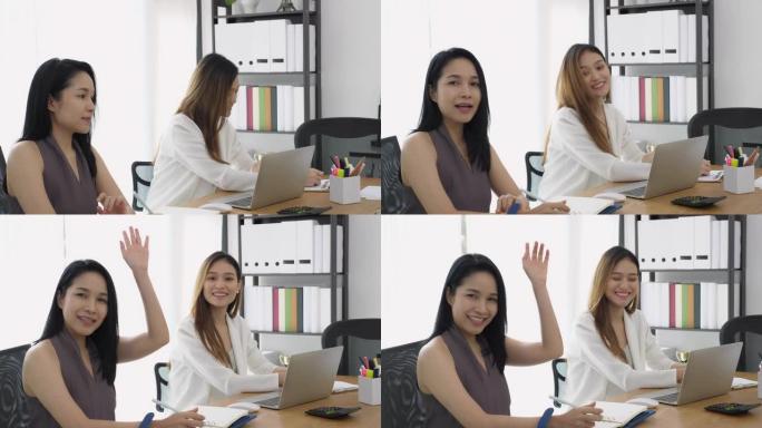 一群在办公室开会的美丽的亚洲女性举手提问或集思广益创业项目。赋权女性团队合作的概念。
