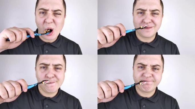 带有血液特写的牙刷。一名男子在刷牙时发现牙龈出血。牙龈炎或牙周病